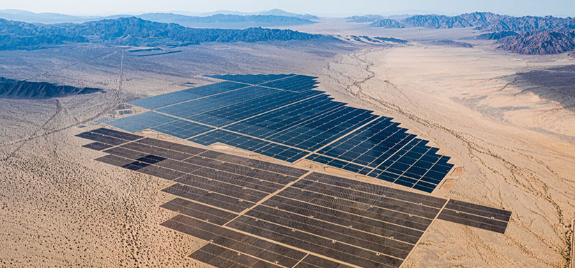 An aerial image of solar panels in the desert.