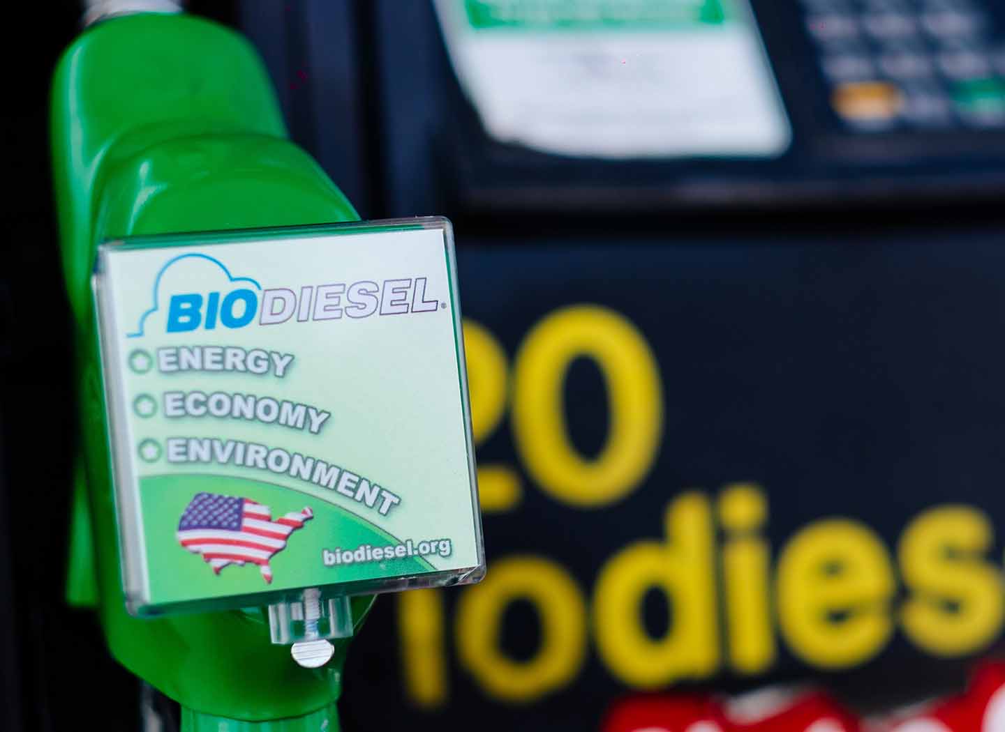 A gas pump with the words: biodiesel. energy. economy. environment.