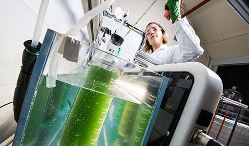 a researcher working on equipment in a lab