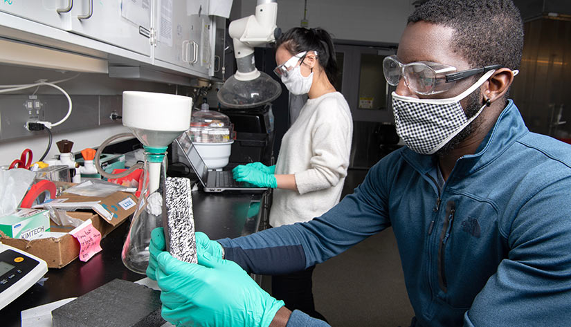 NREL building researchers work in a lab.