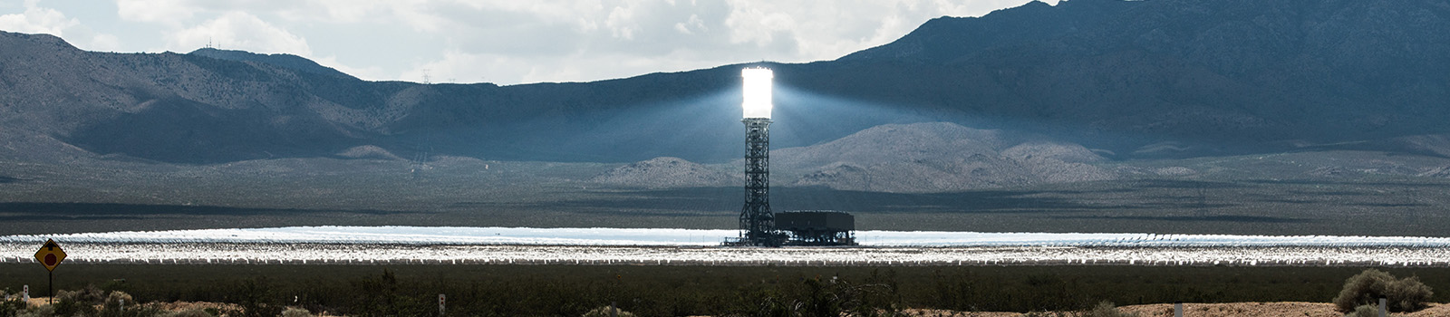 Hundreds of surrounding mirrors reflect the sunlight on a concentrating solar power tower