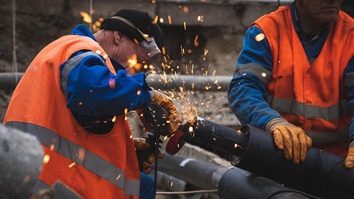 Two people welding