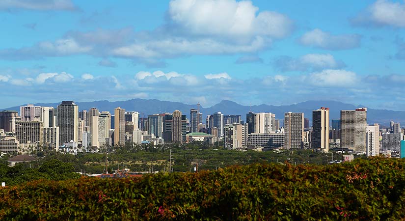 A city skyline view with blue skies.