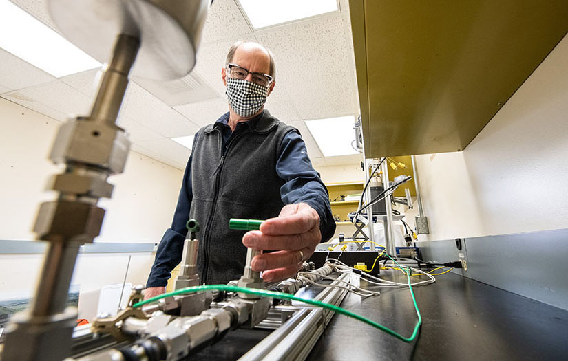 Photo of a researcher working with equipment in a laboratory