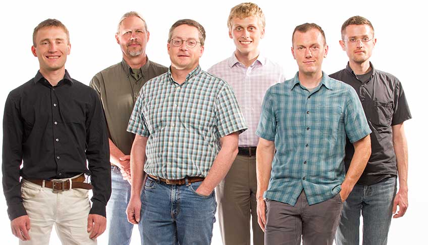 Six men with NREL’s HTEM Database group pose for a photograph.