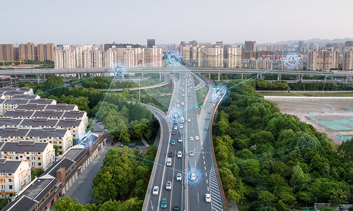 An aerial image of a major freeway with connected and automated vehicles.