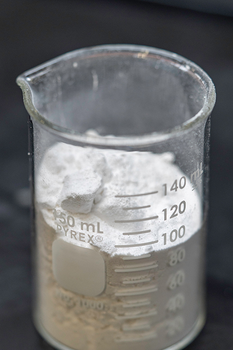 A beaker full of white powder. 