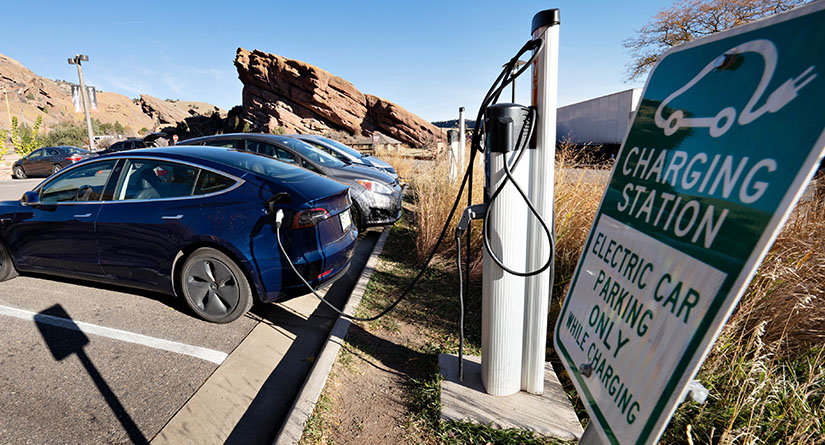 Electric vehicle charging in parking spot