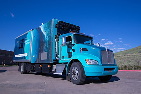 A hydrogen fuel cell truck with the label “H2Rescue” is parked at a hydrogen fueling station at the NREL campus in Golden, Colorado.