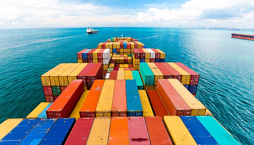 Shipping containers on a cargo ship at sea.